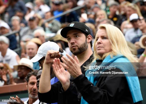 Alexis Ohanian, co-founder and executive chairman of the social news website Reddit, cheers for his wife Serena Williams during her second round...