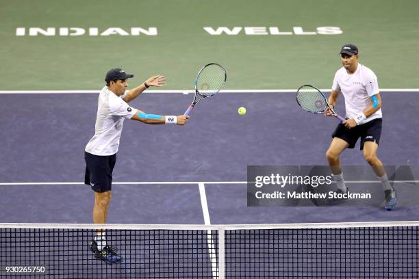 Mike Bryan and Bob Bryan play Alexander Zverev and Mischa Zverev of Germany during the BNP Paribas Open at the Indian Wells Tennis Garden on March...