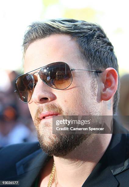 Fans are reflected in the sunglasses of Joel Madden of Good Charlotte as he arrives for the Australian Nickelodeon Kids' Choice Awards 2009 at...