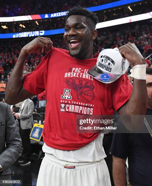 Deandre Ayton of the Arizona Wildcats celebrates after the team defeated the USC Trojans 75-61 to win the championship game of the Pac-12 basketball...