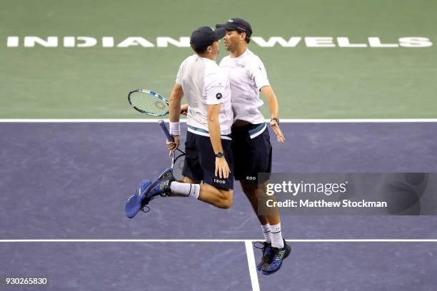 Bob Bryan and Mike Bryan celebrate their win over Alexander Zverev and Mischa Zverev of Germany during the BNP Paribas Open at the Indian Wells...