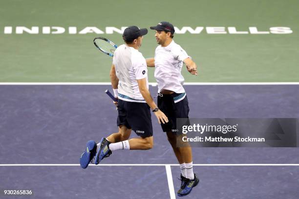 Bob Bryan and Mike Bryan celebrate their win over Alexander Zverev and Mischa Zverev of Germany during the BNP Paribas Open at the Indian Wells...