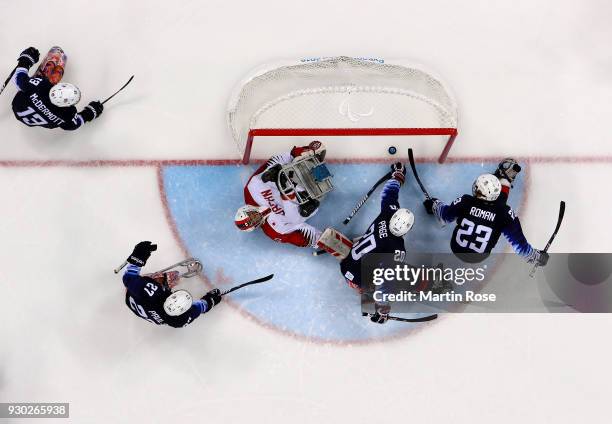 Rico Roman of United States scores a goal the Ice Hockey Preliminary Round - Group B game between United States and Japan during day two of the...