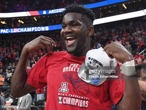 Deandre Ayton of the Arizona Wildcats celebrates after the team defeated the USC Trojans 75-61 to win the championship game of the Pac-12 basketball...