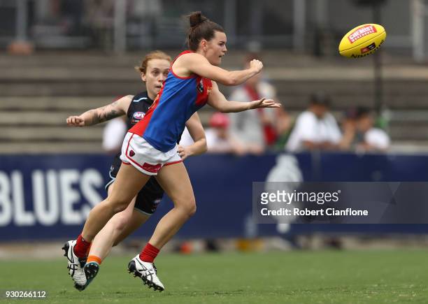 Lily Mithen of the Demons handballs during the round six AFLW match between the Carlton Blues and the Melbourne Demons at Ikon Park on March 11, 2018...