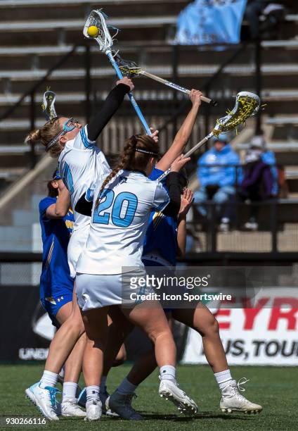 Johns Hopkins Morgayne Rix reaches p for the ball during a women's college Lacrosse game between the Johns Hopkins Blue Jays and the Hofstra Pride on...