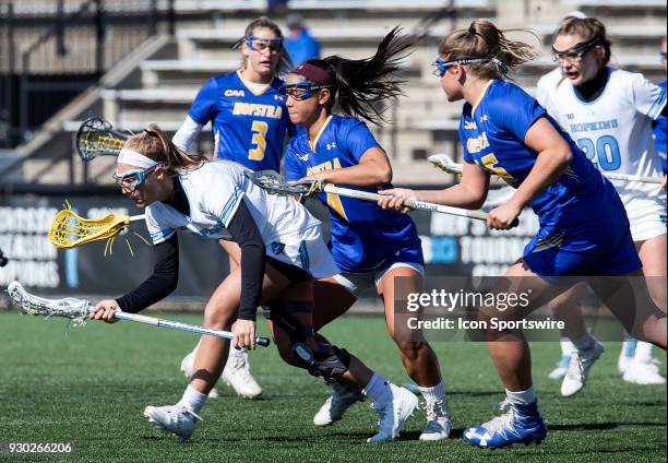 Hofstra Elena Schorr checks into Johns Hopkins Aurora Cordingley during a women's college Lacrosse game between the Johns Hopkins Blue Jays and the...