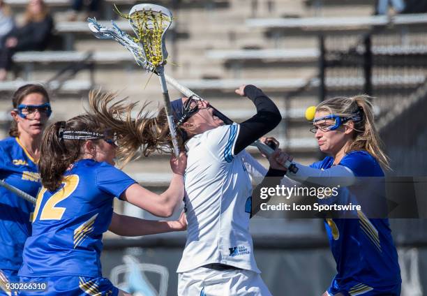 Hofstra Drew Shapiro checks into Johns Hopkins Nicole DeMase during a women's college Lacrosse game between the Johns Hopkins Blue Jays and the...