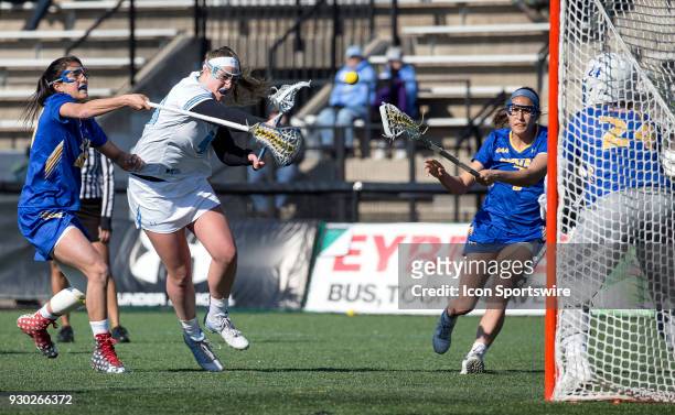 Johns Hopkins Mackenzie Heldberg slings in a fierce shot during a women's college Lacrosse game between the Johns Hopkins Blue Jays and the Hofstra...