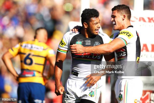 Waqa Blake of the Panthers celebrates with his team mate Nathan Cleary of the Panthers after scoring a try during the round one NRL match between the...