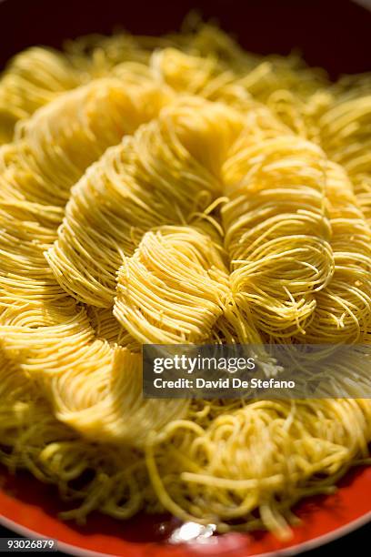 dried homemade pasta - angel hair pasta stock pictures, royalty-free photos & images