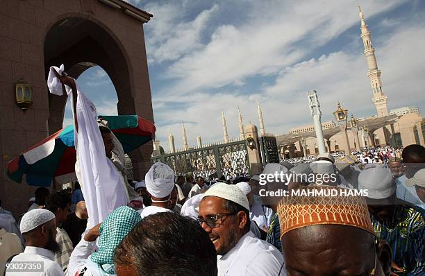 Muslim pilgrims crowd the streets near the Prophet Mohammed Mosque in the Saudi holy city of Medina on November 13, 2009. More than three million...