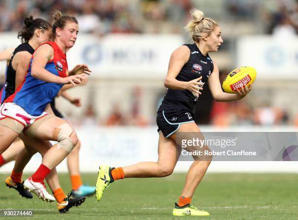 Sarah Hosking of the Blues runs with the ball during the round six AFLW match between the Carlton Blues and the Melbourne Demons at Ikon Park on...