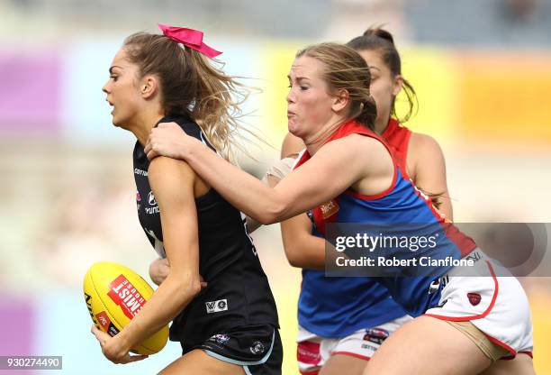 Jessica Kennedy of the Blues is challenged by Eden Zanker of the Demons during the round six AFLW match between the Carlton Blues and the Melbourne...