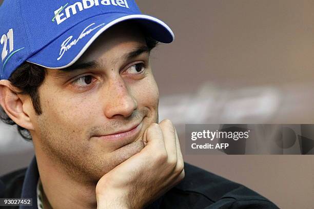 Brazilian Bruno Senna smiles during a press conference for his official presentation as driver of the Campos Meta Formula One team on November 10,...