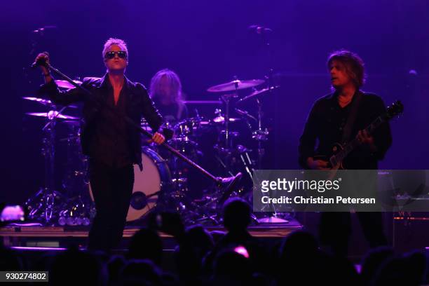 Singer Jeff Gutt , guitarist Dean DeLeo and drummer Eric Kretz of Stone Temple Pilots perform at Marquee Theatre on March 10, 2018 in Tempe, Arizona.