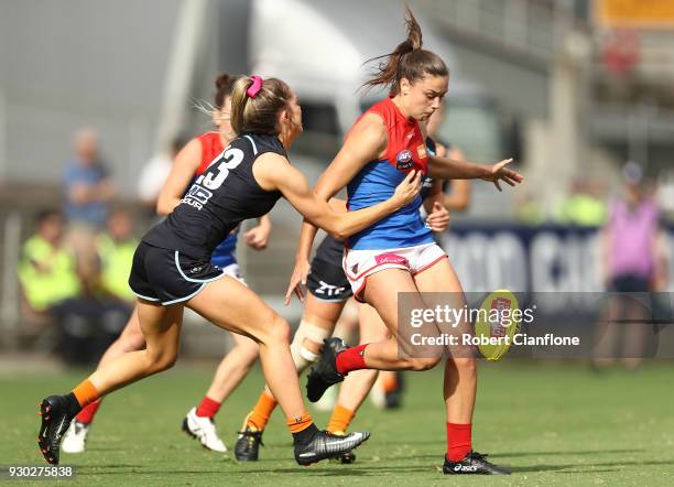 Claudia Whitfort of the Demons kicks the ball during the round six AFLW match between the Carlton Blues and the Melbourne Demons at Ikon Park on...