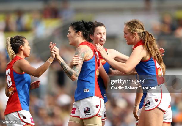 Tegan Cunningham of the Demons celebrates after kicking a goal during the round six AFLW match between the Carlton Blues and the Melbourne Demons at...