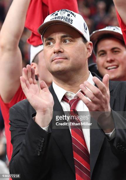 Head coach Sean Miller of the Arizona Wildcats celebrates after his team defeated the USC Trojans 75-61 to win the championship game of the Pac-12...