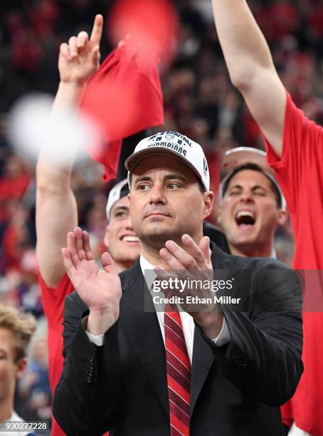 Head coach Sean Miller of the Arizona Wildcats celebrates after his team defeated the USC Trojans 75-61 to win the championship game of the Pac-12...