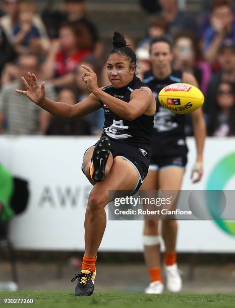 Darcy Vescio of the Blues kicks the ball during the round six AFLW match between the Carlton Blues and the Melbourne Demons at Ikon Park on March 11,...
