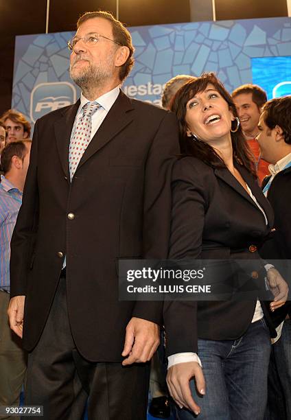 The leader of the Spanish Popular Party and Spain's opposition leader, Mariano Rajoy poses next to the President of the Catalan PP Alicia Sanchez...