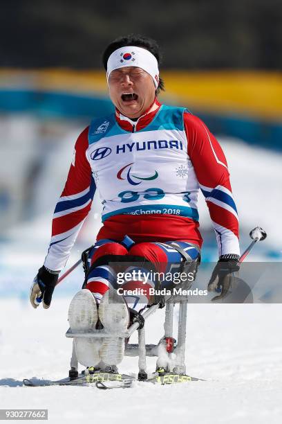 Vo Ra Mi Seo of Korea cries after crossing the finish line during the Women's Cross Country 12km - Sitting event at Alpensia Biathlon Centre during...