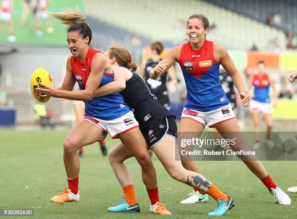 Aliesha Newman of the Demons is challenged by Tilly Lucas-Rodd of the Blues during the round six AFLW match between the Carlton Blues and the...