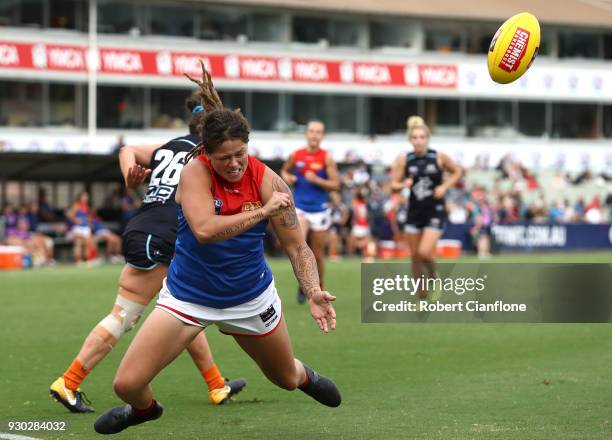 Richelle Cranston of the Demons handballs during the round six AFLW match between the Carlton Blues and the Melbourne Demons at Ikon Park on March...