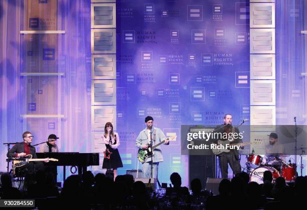 Eric Howk, Jason Sechrist, Zoe Manville, John Gourley, Zacharly Scott Carothers and Jason Sechrist of the band Portugal. The Man perform onstage at...