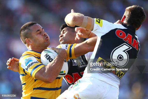 Jarryd Hayne of the Eels is tackled during the round one NRL match between the Penrith Panthers and the Parramatta Eels at Panthers Stadium on March...