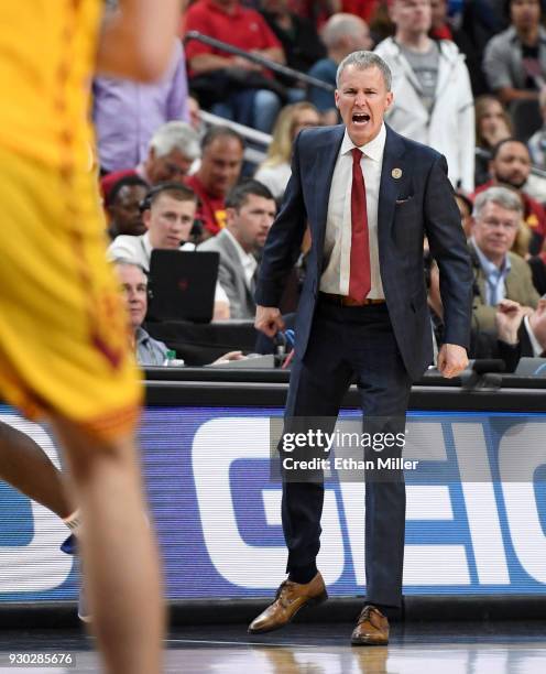 Head coach Andy Enfield of the USC Trojans yells to his players during the championship game of the Pac-12 basketball tournament against the Arizona...