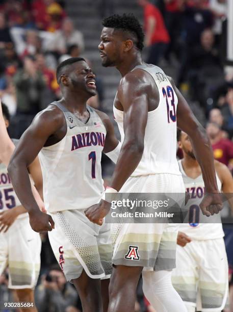 Rawle Alkins and Deandre Ayton of the Arizona Wildcats celebrate on the court after Alkins and then Ayton dunked against the USC Trojans during the...