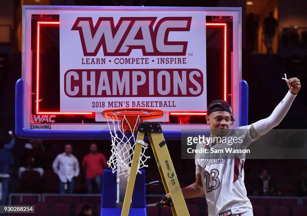 Zach Lofton of the New Mexico State Aggies cuts a piece of the net after beating the Grand Canyon Lopes 72-58 in the championship game of the Western...