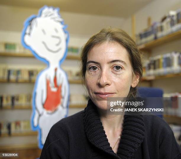 Anne Goscinny, daughter of French writer Rene Goscinny poses for a photography after she promotes the Polish edition of the book 'Histoires inédites...