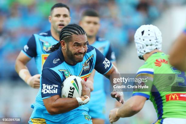 Konrad Hurrell of the Titans runs the ball during the round one NRL match between the Gold Coast Titans and the Canberra Raiders at Cbus Super...