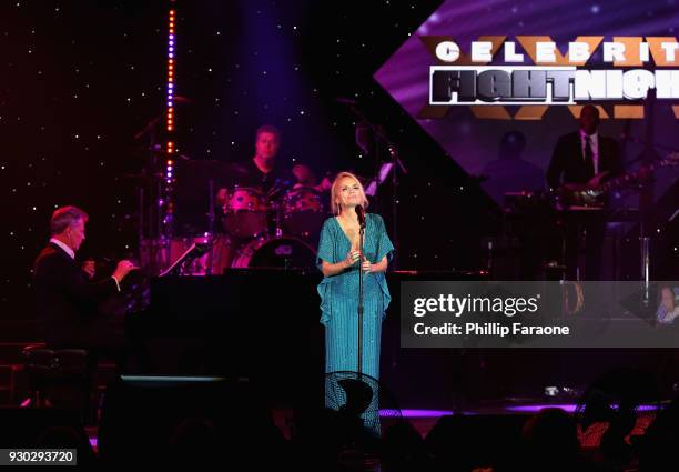 David Foster and Kristin Chenoweth perform onstage at Celebrity Fight Night XXIV on March 10, 2018 in Phoenix, Arizona.