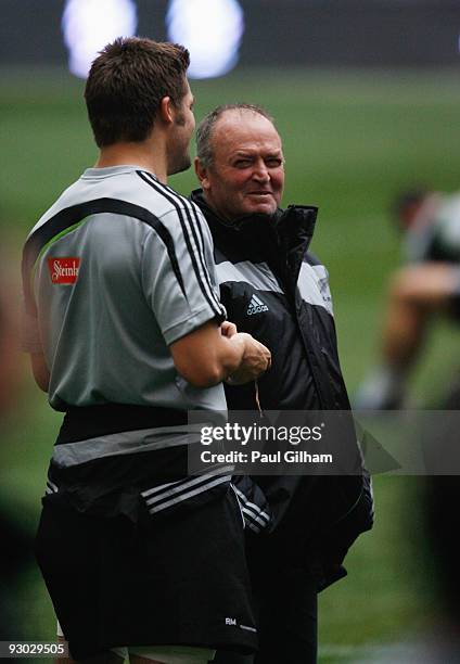 Coach Graham Henry talks to Richie McCaw of New Zealand during the Captain' s Run at the San Siro Stadium on November 13, 2009 in Milan, Italy.