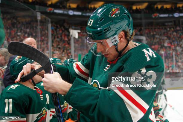Tyler Ennis of the Minnesota Wild tapes his stick during the game against the Detroit Red Wings at the Xcel Energy Center on March 4, 2018 in St....
