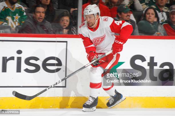 Luke Glendening of the Detroit Red Wings skates with the puck against the Minnesota Wild during the game at the Xcel Energy Center on March 4, 2018...