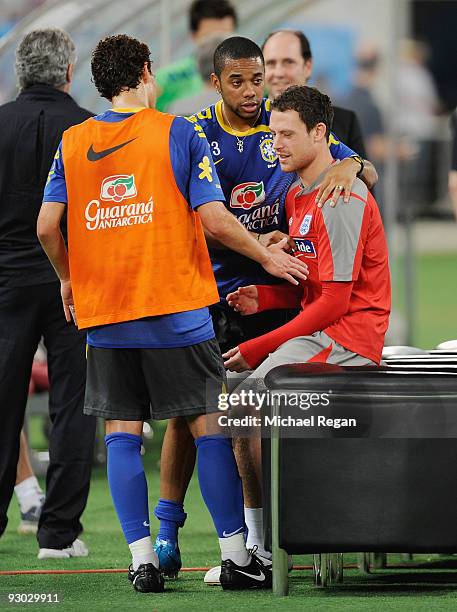 Robinho and Elano of Brazil meet Manchester City team mate Wayne Bridge during the England training session at the Khalifa Stadium on November 13,...