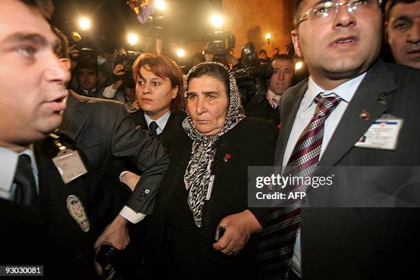 President of the association of Mothers of Turkish Soldiers killed fighting terrorism Pakize Akbaba is escorted out by security members on November...