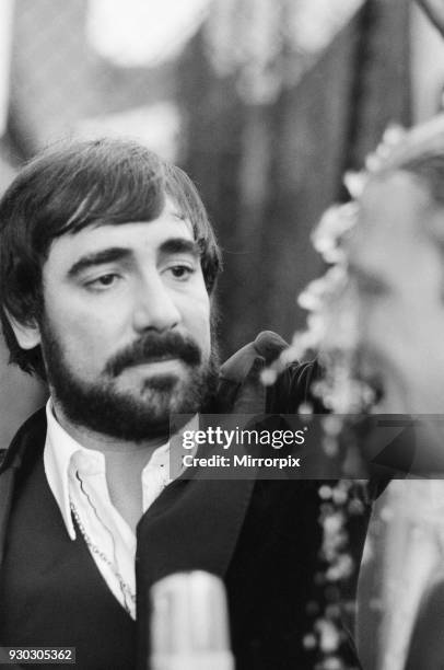 The Who rock group in concert at The Valley, home ground of Charlton Athletic Football Club. Drummer Keith Moon pours vodka over 'Australian local...