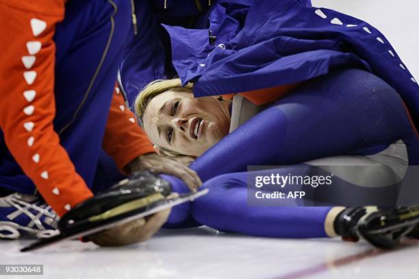 Dutch Marianne Timmer lies on the ice after she fell during her 500 meter race at the ISU World Cup speedskating in Heerenveen, on November 13, 2009....