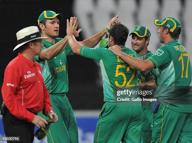 Graeme Smith of South Africa celebrates the run-out of Jonathan Trott of England for 33 runs during the 1st Standard Bank International Pro20 match...