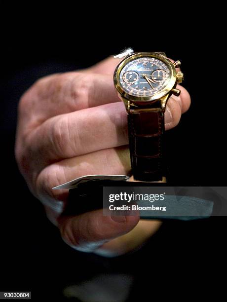 Rolex 18-carat gold chronograph, model 3525 "prisoner watch" is displayed during a media preview for an auction which includes jewelry and other...