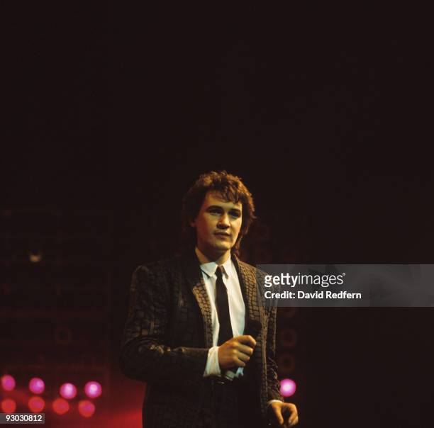Irish singer Johnny Logan performs on stage in the 1980's.