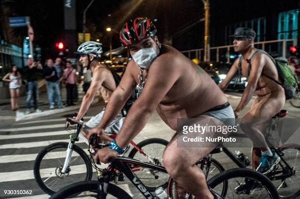 Explicit Content] People take part in Sao Paulo, Brazil, on 10 March 2018 at the 11th edition of the World Naked Bike Ride, the bicicletada pelada,...