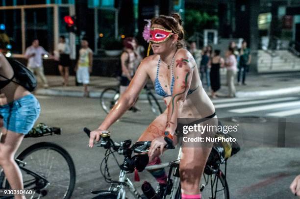 Explicit Content] People take part in Sao Paulo, Brazil, on 10 March 2018 at the 11th edition of the World Naked Bike Ride, the bicicletada pelada,...