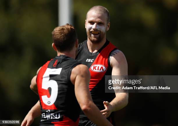 Jake Stringer of the Bombers celebrates with Devon Smith of the Bombers during the AFL 2018 JLT Community Series match between the Geelong Cats and...
